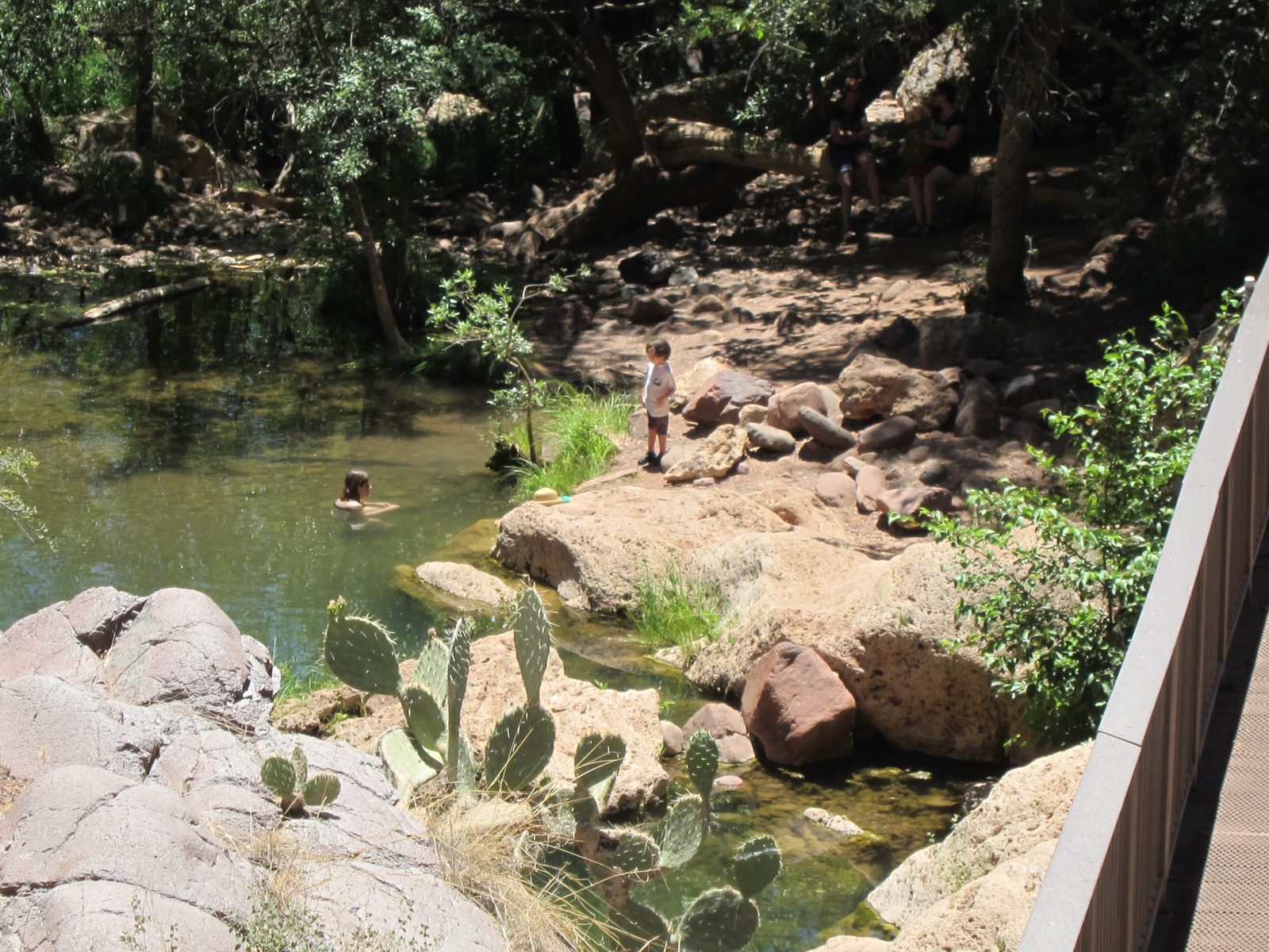 A swimming hole below the bridge which is off to the right in this scene